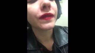 Attractive Goth Skank Smokes Cigarette Close up in Red Lipstick