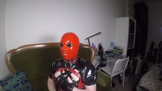 Trailer Heavy Rubber Mask, Solo Pleasure by miss Maskerade in Latex Corset Gagged Playing with Dildo