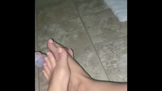 Giving my dildo a footjob with my charming feet