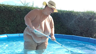 SSBBW with enormous natural tits cleaning the pool in tiny bikini! By Viola Tittenfee