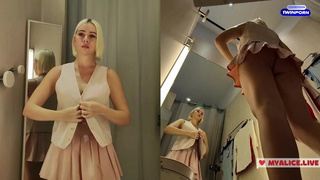 Changing in a public locker room. Transparent clothes on monstrous tits