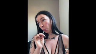 Busty british babe teases you while blowing a lollipop