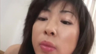 Titty fucking chinese MILF babe jerks wang