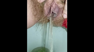 Stunning fart and large waterfall of piss from a juicy hairy vagina in red panties closeup