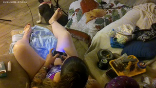 Roommate stands over me from rear-end and films down my blouse while I smoke and play film games
