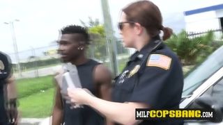 Horny Female Cops take turns to Suck and Lick this BIG Black Cock in public, watch the action Now.