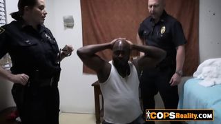 Big black dude gets picked by the horny officers to give them pleasure with his dong
